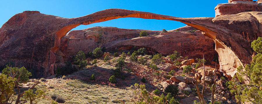 Long and delicate Landscape Arch in Arches National Park in the late afternoon of a beautiful fall day